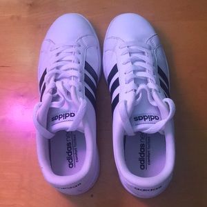 Adidas white shoes.